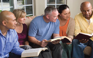 Five people studying the Bible